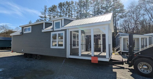 park model pulled by delivery truck