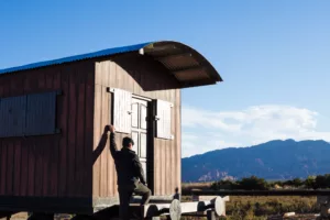 man in a tiny house